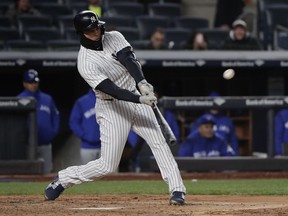 New York Yankees' Giancarlo Stanton connects for a two-run home run against the Toronto Blue Jays during the third inning of a baseball game Friday, April 20, 2018, in New York.
