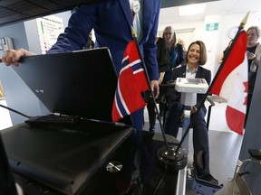Norwegian Ambassador to Canada Anne Kari Hansen Ovind tries out Motiview at the Élisabeth Bruyère Hospital in Ottawa on Friday, April 13, 2018.
