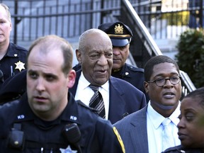 Bill Cosby, center, leaves hearings for jury selection in his sexual assault retrial with spokesperson Andrew Wyatt, second right, Thursday, April 5, 2018, at the Montgomery County Courthouse in Norristown, Pa.