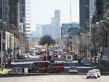 First responders close down Yonge Street in Toronto after a van mounted a sidewalk crashing into a number of pedestrians on Monday, April 23, 2018.