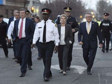 Toronto Mayor John Tory, left to right, Toronto Police Chief Mark Saunders, Premier Wynne and Ralph Goodale, Federal Minister of Public Safety and Emergency Preparedness, walk together towards a news conference after viewing the scene where nine people died and 16 others were injured when a van mounted a sidewalk and struck multiple pedestrians Toronto on Monday, April 23, 2018.