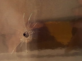 Evidence photo of a bullet hole found at the scene of a shooting at a Quebec City mosque released Thursday at the sentencing hearing for Alexandre Bissonnette.