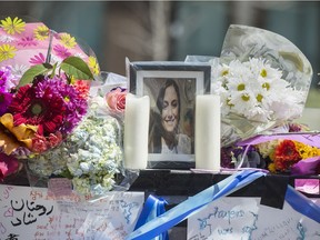 A photo of one of the van attack victims placed among flowers on Yong Street, Thursday April 26, 2018.