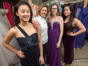 From left, Adeline Wang, 18, teacher Karen Kurlicki, Marley Cameron, 18, and Sophie Ideias, 18. Kurlicki has organized a "Pop-Up Prom Shop" in an empty portable at the back of Bell High School packed full of formal-wear clothes donated from the community.
