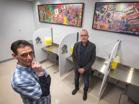 Community worker J.P. Leblanc (L) and Rob Boyd, the head of the Oasis harm-reduction program at the Sandy Hill Community Health Centre inside the new supervised injection site. The site features five separate stations where addicts are able to inject their drugs. The Sandy Hill Community Health Centre was actually the first SIS in Ottawa that received conditional federal approval (back in July 2017), but it has been renovating its space to build the SIS at its building since then.