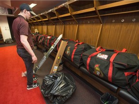 Alex Burrows looks over his packed equipment after he and other Senators players cleared out their locker stalls on Monday.