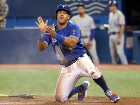 Yangervis Solarte of the Toronto Blue Jays celebrates after sliding across home plate during MLB action against the Kansas City Royals at Rogers Centre on April 18, 2018 in Toronto. (Tom Szczerbowski/Getty Images)