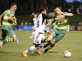 Fury FC's Kevin Oliveira (88) tries to take possession of the ball away from the Rowdies' Neill Collins (3) during a United Soccer League game last Saturday in Tampa, Fla. Fury FC lost 5-0 to fall to 0-2 for the season. Tampa Bay Rowdies photo