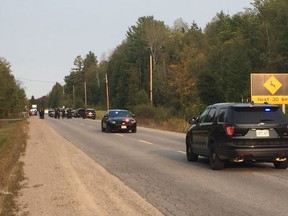 Ontario Provincial Police rescued a child and apprehended a suspect wanted in two Quebec killings on Renfrew County Road 132, just west of Dacre on Sept. 15, 2017.