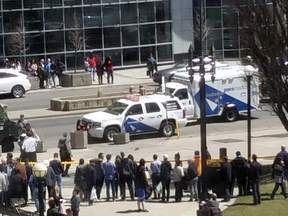 Paramedics attend to people after multiple pedestrians were struck by a van in Toronto on April 23, 2018.