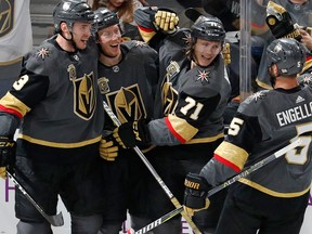 Vegas Golden Knights players celebrate after a goal by centre William Karlsson against the San Jose Sharks during an NHL game on March 31, 2018