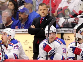 Rangers coach Alain Vigneault stares out at the ice during a 2017 playoff game against the Senators.   Wayne Cuddington/Postmedia