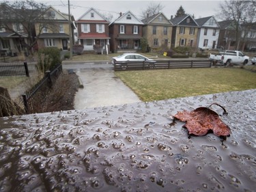 Ice from freezing rain starts to form on a railing in Toronto on Saturday April 14, 2018. Environment Canada has issued a weather warning that up to 20mm or ice build up is possible.