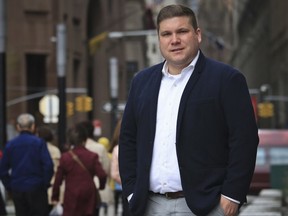 Omar Gonzalez-Pagan, lawyer for the LGBT civil rights group Lambda Legal, poses outside his Manhattan office, Friday April 27, 2018, in New York. Military service, bathroom use, job bias and now health care. The Trump administration is under fire for rewriting a rule barring discrimination in health care due to "gender identity." Groups representing transgender people expect the Obama protections to be gutted and are preparing to take the administration to court. "The proposed rollback does fit into a pattern of transphobia and anti-LGBT sentiment in this administration," said Gonzalez-Pagan.