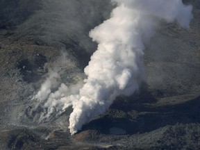 CORRECTS YAER - In this April 19, 2018, photo, volcanic smoke billows from Mt. Io, part of the Kirishima mountain range on Japan's southern main island of Kyushu, taken over Ebino city, Miyazaki prefecture. The Meteorological Agency said Friday, April 20, 2018 that Mt. Io erupted for the first time since 1768, spewing smoke and ash high into the sky. The agency has expanded a no-go zone to the entire mountain from just around the volcano's crater. (Kyodo News via AP)