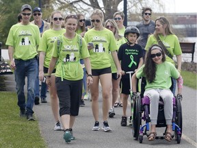 Kristy Wood-Giles, left, kicks off her TransCanada Trek for Lyme with friends and supporters in Ottawa on Saturday, May 5, 2018.