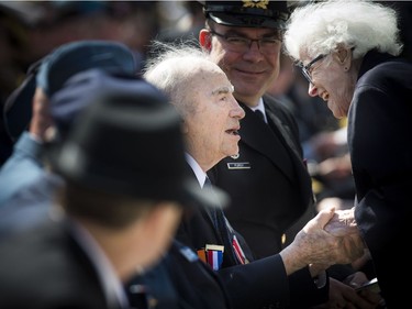 The Anniversary of the Battle of the Atlantic Ceremony to commemorate the sacrifices made by thousands of Canadians who fought in the North Atlantic took place in Ottawa Sunday May 6, 2018, at the National War Memorial. Second World War veterans Alex Polowin greeted by Elsa Lessard.  Ashley Fraser/Postmedia