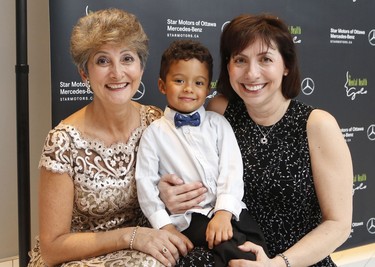 From left, event volunteer Maria Bauer, Matteo, 3.5 years, and Sandra Donatucci.