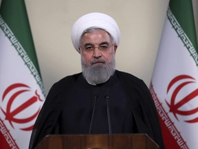 In this photo released by official website of the office of the Iranian Presidency, President Hassan Rouhani addresses the nation in a televised speech in Tehran, Iran, Tuesday, May 8, 2018.