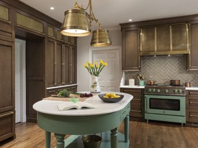 This kitchen project by designer Caryn Cramer used Benjamin Moore's Parsley Snips green on a free-standing work surface that was custom-built by Van Walker Woodworking.
