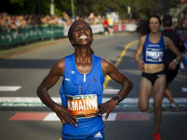 Gladys Kimaina the third place female comes across the finish line of the 10K race Saturday May 26, 2018 at Ottawa Race Weekend.