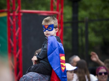 A young super fan checks out the runners passing by at the start line of the 2K race Saturday May 26, 2018 at Ottawa Race Weekend.