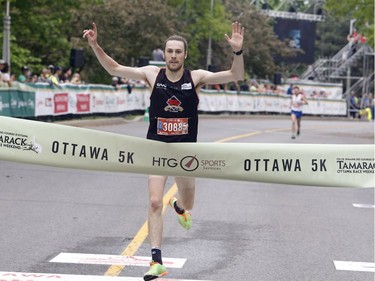 Philippe Brochu of Quebec City wins the 5k at the Ottawa Race Weekend on Saturday, May 26, 2018.   (Patrick Doyle)  ORG XMIT: 0527 race weekend 03