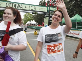 Tina Boileau, the mother of Jonathan Pitre, finishes the 5k at the Ottawa Race Weekend on Saturday, May 26, 2018.