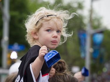 Three-year-old Abigail Maley cheers on the runners start the marathon Sunday May 27, 2018 at Ottawa Race Weekend.    Ashley Fraser/Postmedia