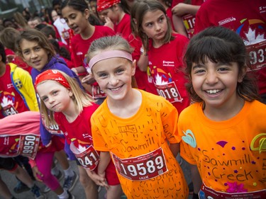Lillie Byers (centre) at the start line of the kids marathon Sunday May 27, 2018 at Ottawa Race Weekend.    Ashley Fraser/Postmedia