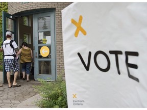 Voters arrive at a polling station in 2014. This time around there will be 17 new seats to be filled at Queen's Park.