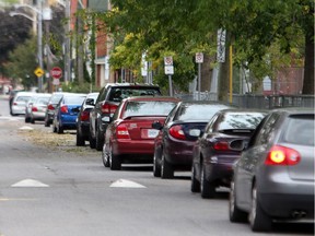 Cars parked on street in downtown Ottawa.