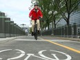 - Cyclists try out the new track, which runs in front of the American Embassy and beside the Chateau Laurier from the National Gallery (rear).  Ottawa mayor Jim Watson and other dignitaries officially opened the new Mackenzie Avenue cycling path Friday (May 19, 2017) at the York Street Pedestrian Crossing with a ribbon cutting. Julie Oliver/Postmedia