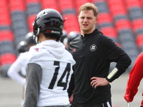 Quarterback Danny Collins chats with RJ Shelton (L) of the Ottawa Redblacks during their mini camp at TD Place in Ottawa, April 24, 2018.