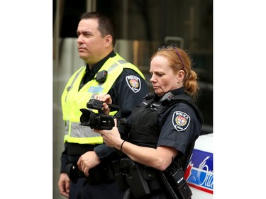 Police videotape the bubble zone area around the Morgentaler Clinic on Bank. Carrying pro-life placards, singing songs and chants, thousands of people paraded through downtown Ottawa Thursday (May 10, 2018) for the March for Life rally. They were met by a few hundred vocal pro-choice protesters at some intersections, but the two groups were kept separated by a strong police presence.
