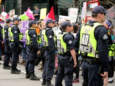 Police keep the pro-choice protesters at bay. Carrying pro-life placards, singing songs and chants, thousands of people paraded through downtown Ottawa Thursday (May 10, 2018) for the March for Life rally. They were met by a few hundred vocal pro-choice protesters at some intersections, but the two groups were kept separated by a strong police presence.