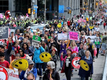 Carrying pro-life placards, singing songs and chants, thousands of people paraded through downtown Ottawa Thursday (May 10, 2018) for the March for Life rally. They were met by a few hundred vocal pro-choice protesters at some intersections (left, at Albert and Metcalfe), but the two groups were kept separated by a strong police presence.
