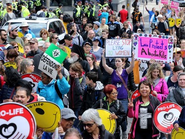 Carrying pro-life placards, singing songs and chants, thousands of people paraded through downtown Ottawa Thursday (May 10, 2018) for the March for Life rally. They were met by a few hundred vocal pro-choice protesters at some intersections, but the two groups were kept separated by a strong police presence.