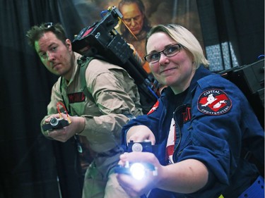 Derek McDonald and Christine Trottier dressed as Ghostbusters during the opening day of Comiccon, May 11, 2018.
