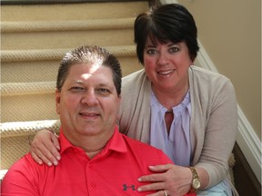 Marc Cashman and his wife Gloria Higdon sitting together in their home. Marc recently survived a massive heart attack and almost died a year ago. Since then, he's lost 40 pounds and is walking with his wife, daughter, and a small group of supporters in the upcoming race weekend.