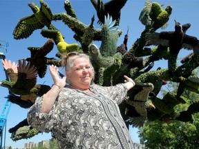Landscape architect and president of the International Mosaiculture International, Lise Cormier, shows off one of her designs called the The Bird Tree, which pays homage to 56 species of bird that are endangered.