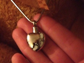 Kingston police looking for stolen necklace containing the ashes of a woman's deceased daughter.