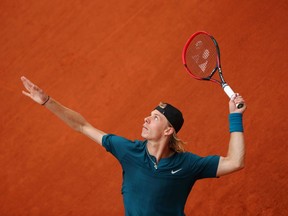 Denis Shapovalov serves to John Millman at the French Open on May 29.