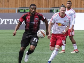 Ottawa Fury FC Jamar Dixon (#22) moves the ball past New York Red Bulls II Alex Muyl during USL regular season play at TD Place Stadium. May 2,2018.