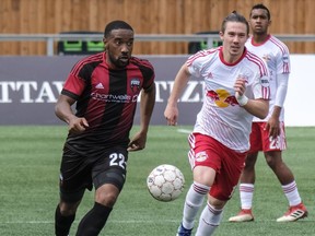 Ottawa Fury FC Jamar Dixon (#22) moves the ball past  New York Red Bulls II Alex Muyl during USL regular season play at TD Place Stadium. May 2,2018.