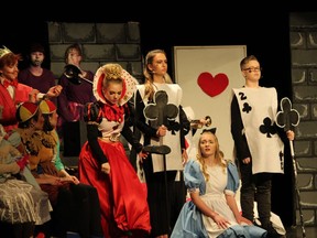 The Queen of Hearts played by Olivia Barber (L),Alice played by Morgan Churchill (M) during St Francis Xavier Catholic High School's Cappies production of Alice in Wonderland, held on April 13, 2018 at St Francis Xavier High School.