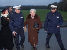 Ursula Haverbeck (2nd R), repeatedly condemned Holocaust denier, is taken away by the police after she tried to attend a trial that started against a former Auschwitz guard on February 11, 2016 in Detmold, western Germany.