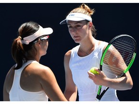 China's Yifan Xu and Ottawa's Gabriela Dabrowski talk tactics in their first round women's doubles match at the Australian Open in January.