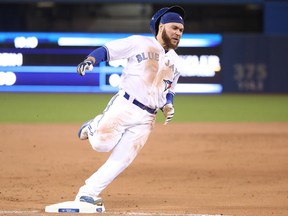 Russell Martin of the Toronto Blue Jays rounds third base and races home to score a run on an RBI single by Luke Maile in the eighth inning during MLB game action against the Seattle Mariners at Rogers Centre on May 9, 2018.