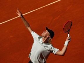Denis Shapovalov of Canada serves against Milos Raonic of Canada in their third round match during day six of the Mutua Madrid Open tennis tournament at the Caja Magica on May 10, 2018 in Madrid, Spain.